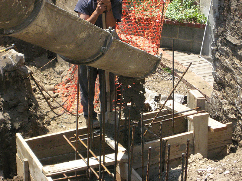 cement being poured into framing