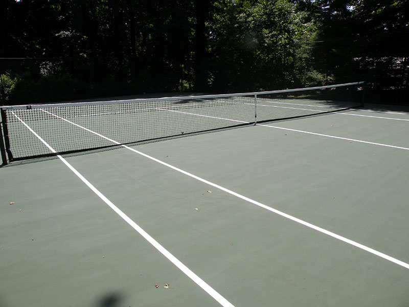 finished tennis court in backyard
